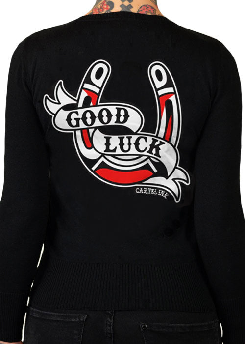 black cardigan with good luck horseshoe on the back by cartel ink for pinky star